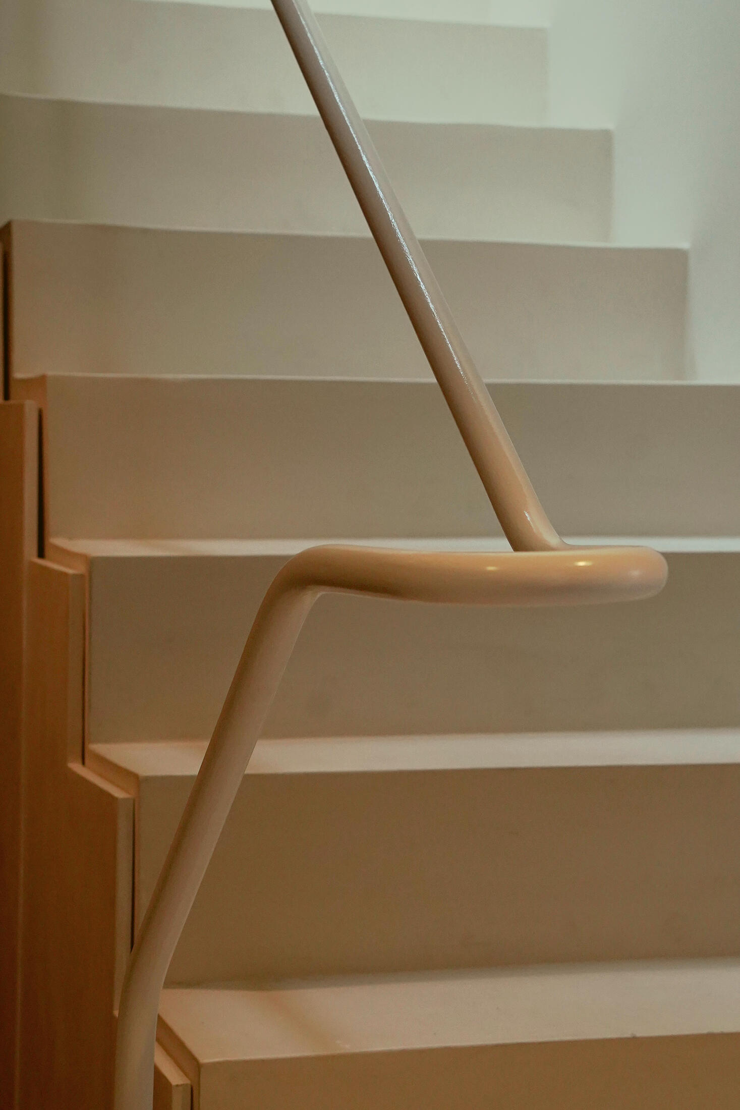 photograph — the handrail, bent from one tube