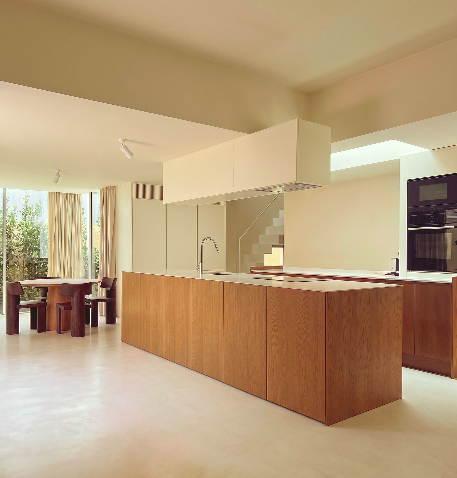 photograph — kitchen and dining, one room