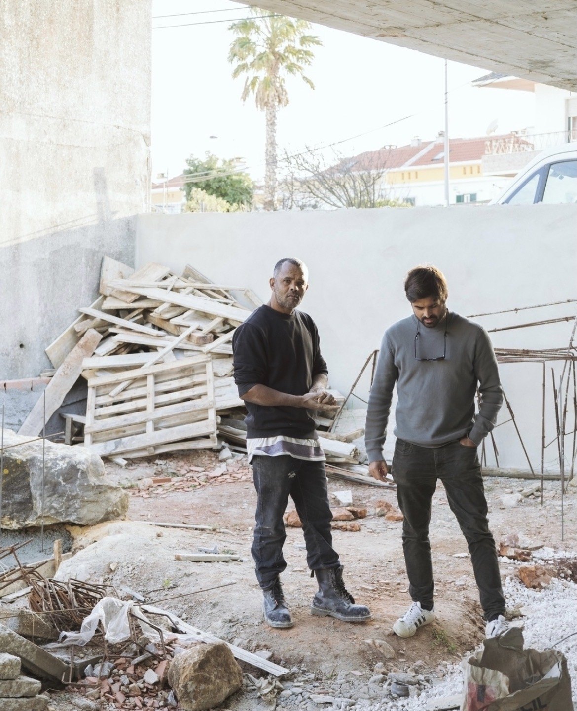 joão veríssimo with one of the builders, on site