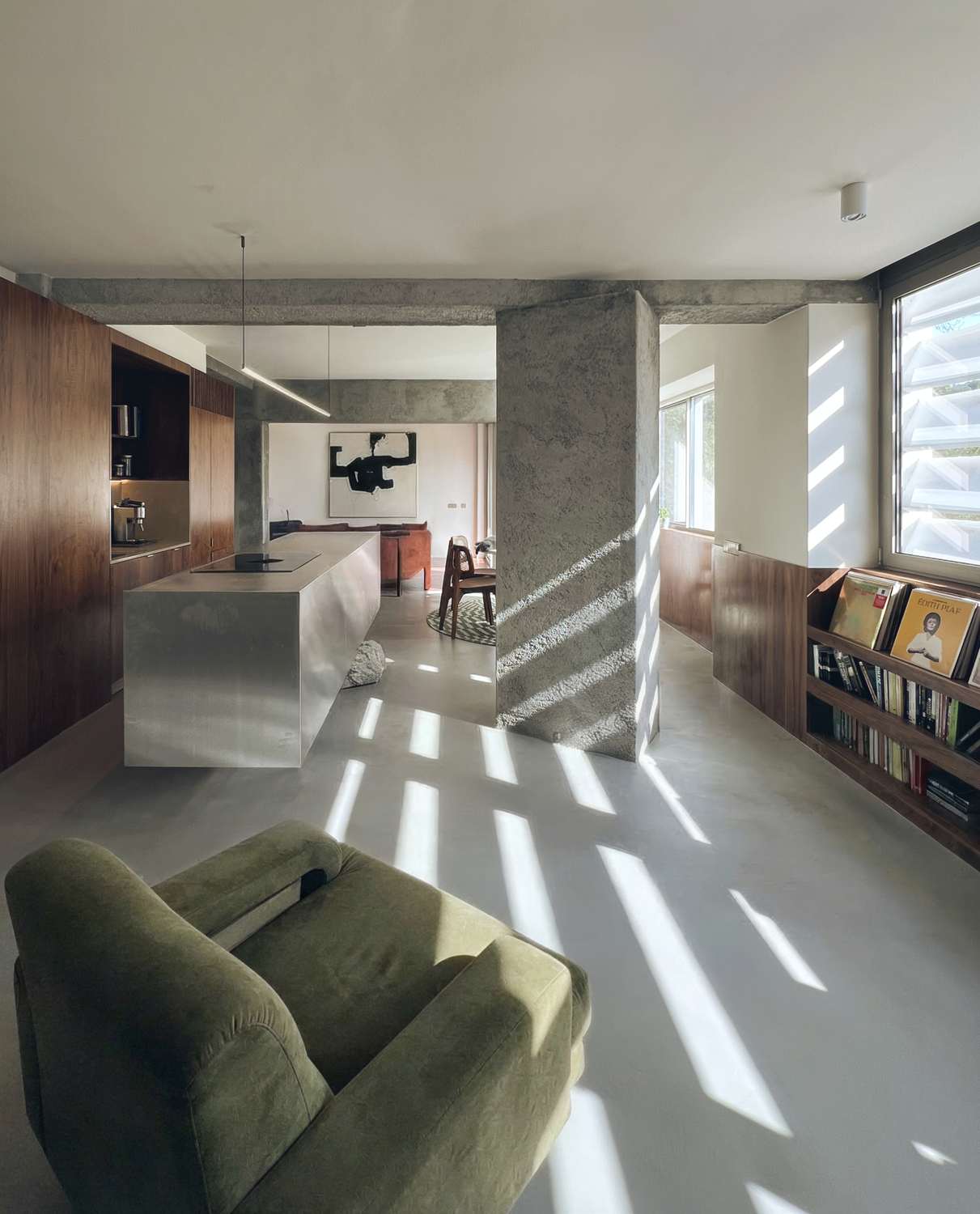 photograph — the long room, light through the concrete brise-soleil