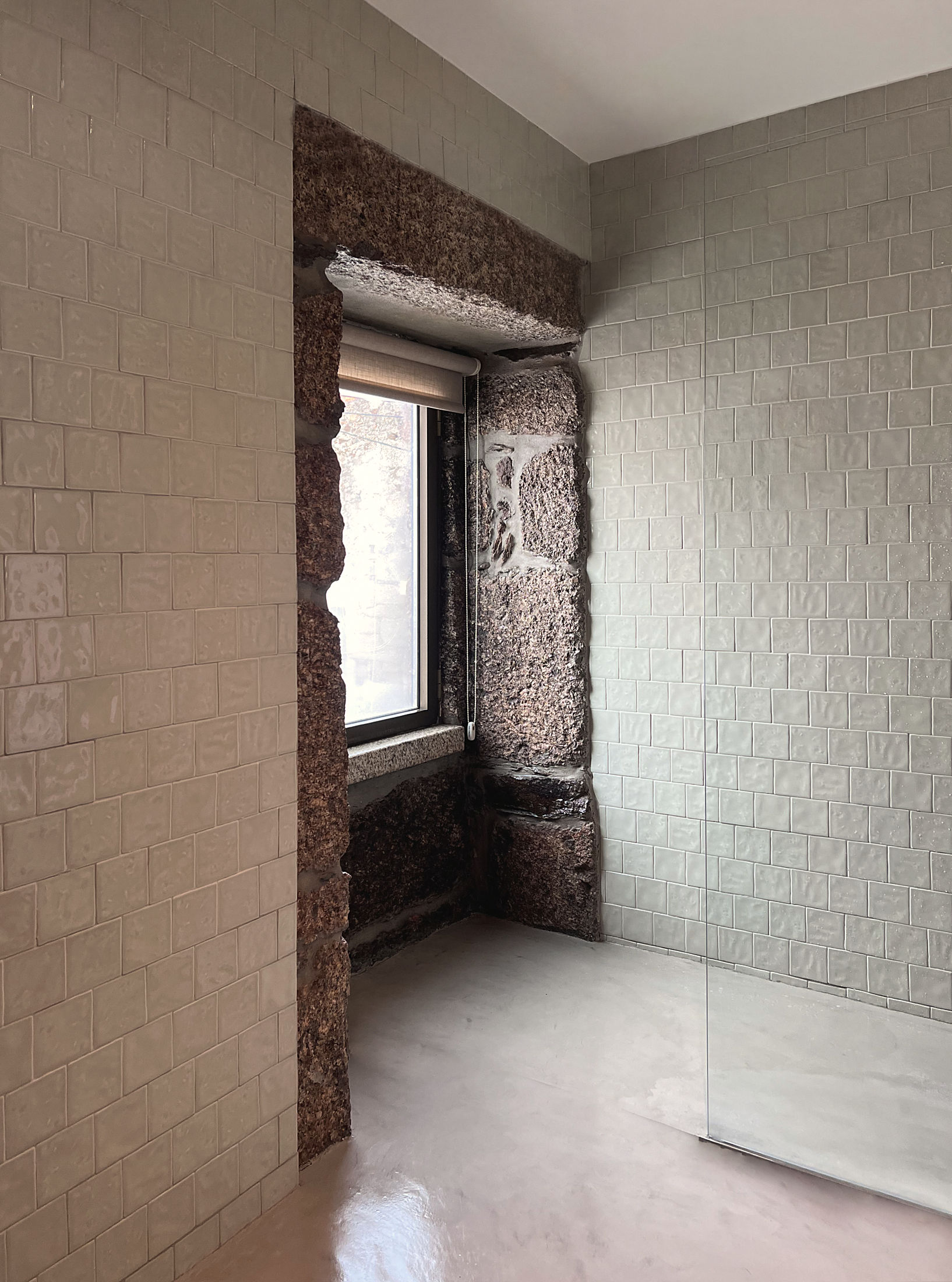 photograph — handmade tile, a window in the granite