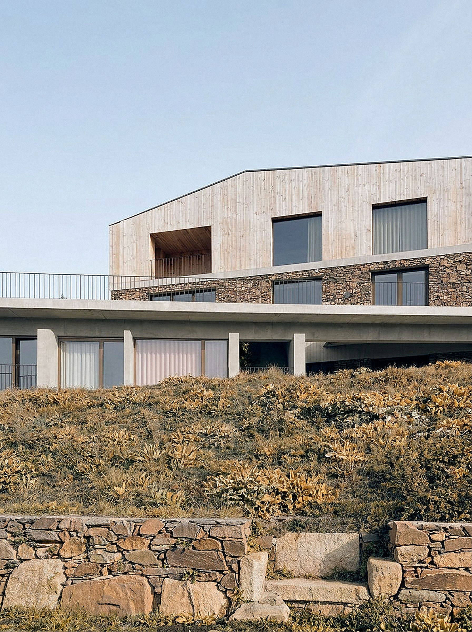 photograph — the hotel over the terraced fields