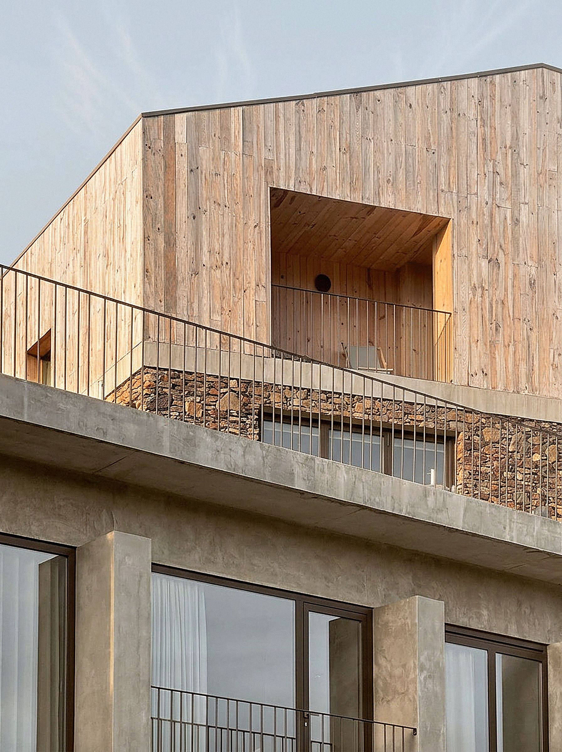 photograph — the timber-clad upper floor