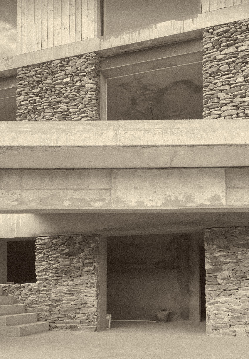 site photograph — schist piers, bare structure