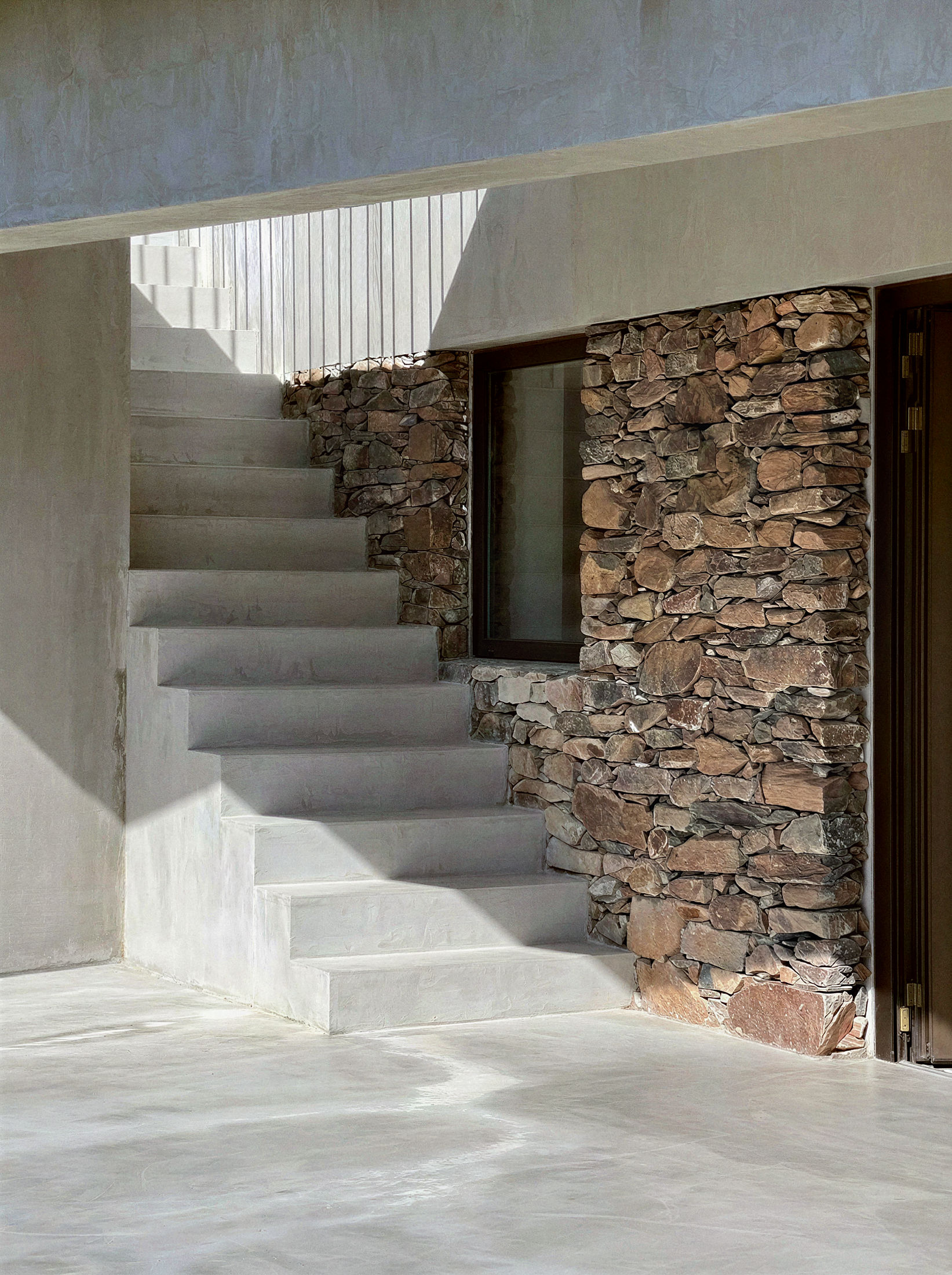 photograph — the outdoor stair, between schist walls