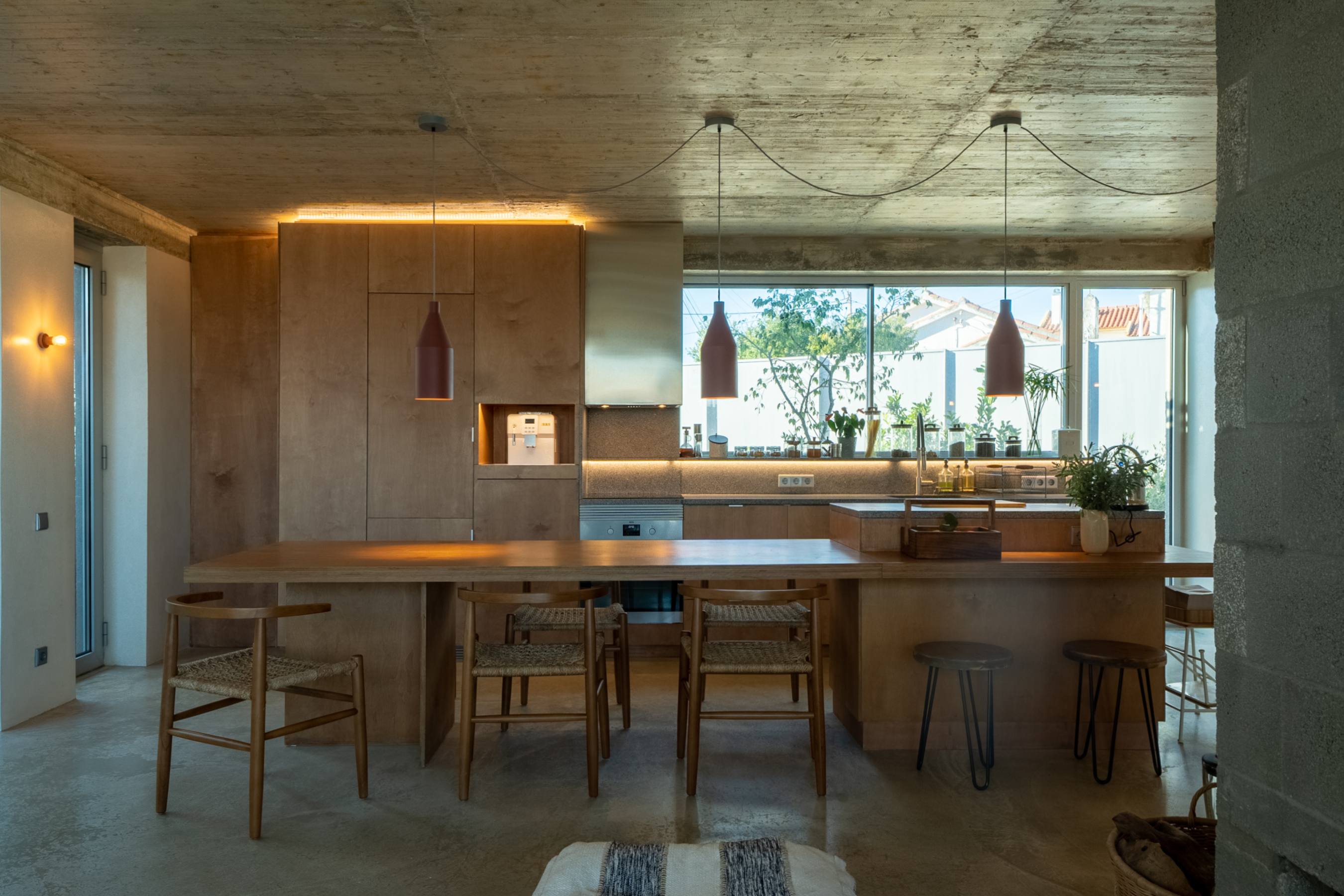 photograph — kitchen and dining between two patios
