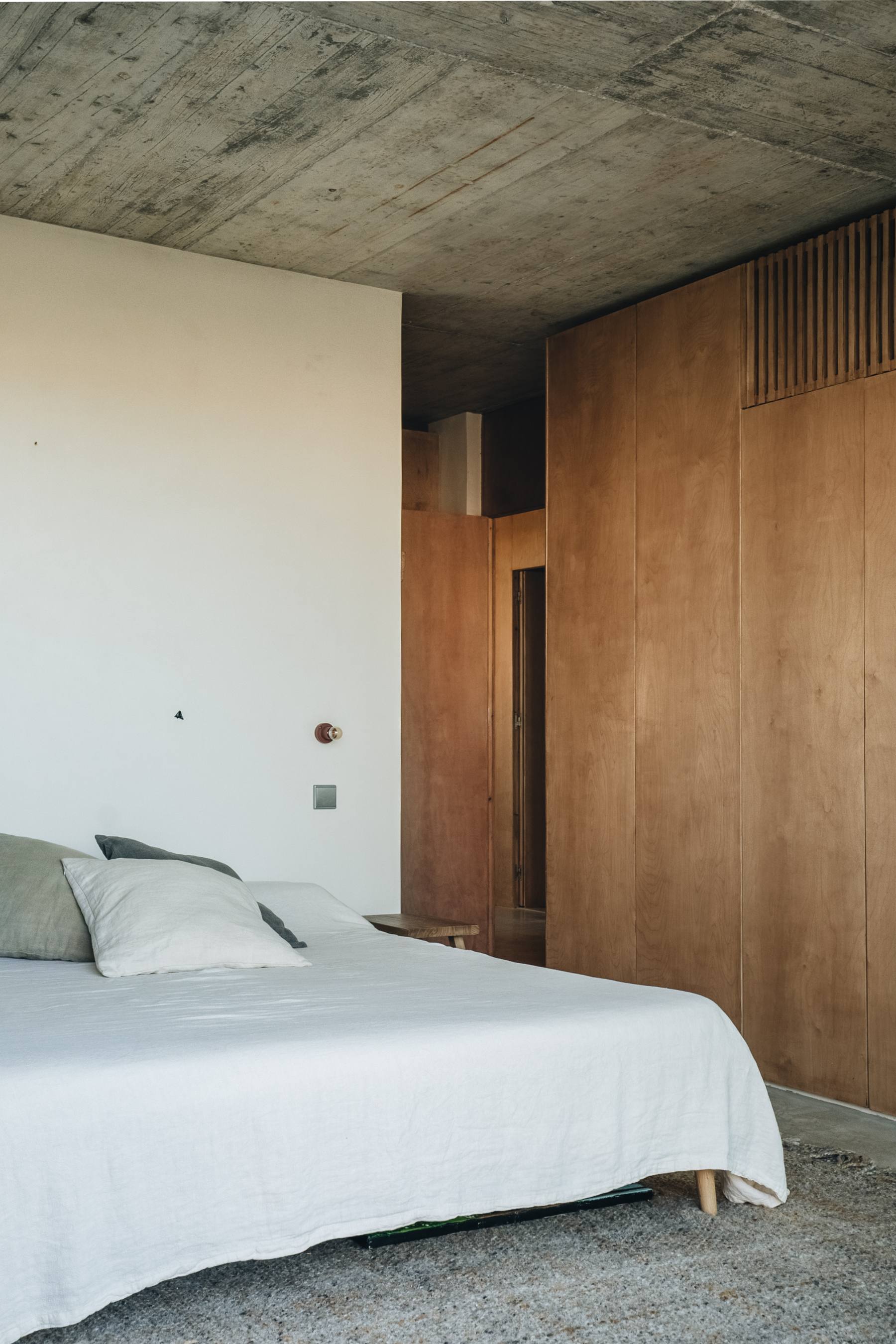 photograph — bedroom, the plywood wall